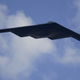A B-2 stealth bombers flies over a NASCAR race in Kansas City, Kan. Sunday, Sept, 29, 2002. The commander of the nation’s fleet of B-2s, Col. Doug Raaberg said his planes and crews are ready should the U.S. go to war with Iraq during an interview Tuesday, Oct. 1, 2002. (AP Photo/Charlie Riedel)